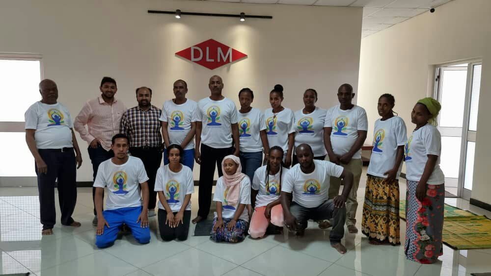 DLM team celebrating International Yoga Day